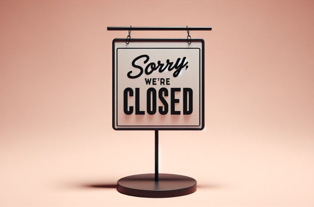 Image of sign labeled "sorry we're closed"